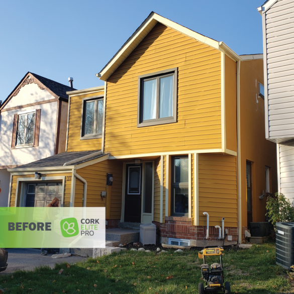 Vinyl siding on house before Cork Elite Pro is applied